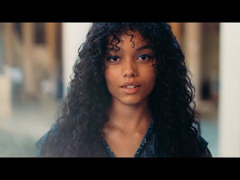 Ladj Ly and Whitney Peak with Caroline de Maigret at the 2022/23 Métiers d'art CHANEL – DAKAR show