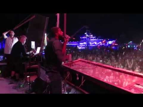 Ras Puma singing with Thievery Corporation as they perform at Burning Man 2014