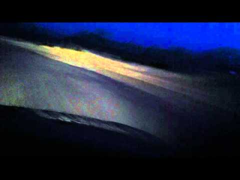 Caspar David Friedrich in a car at night on a ranch in CA. Driving, driving in the rain.