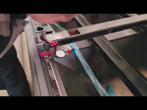 Dial indicator measuring guide rail parallelism