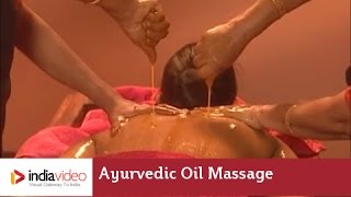 Pizhichil or pouring medicated oil by squeezing a piece of cloth