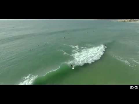 Drone footage of waves and surfing at Praia Da Rocha
