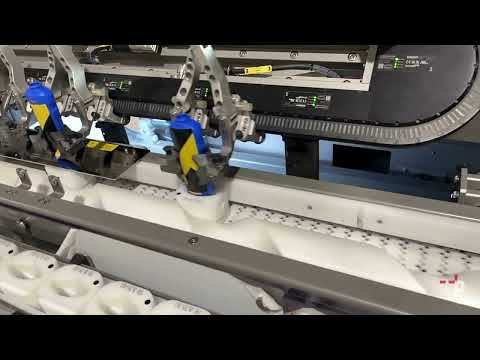 Robotic unscrambler with orientation module - pickFeeder Twin200