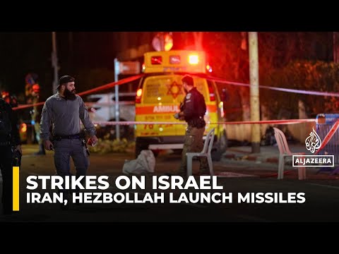 Israel under fire as Iranian missiles, Hezbollah rockets test defences