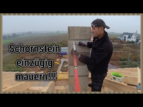 Schornstein,Kamin einzügig mauern, Schamottrohre montieren, Kaminkopf Abdeckung anbringen.