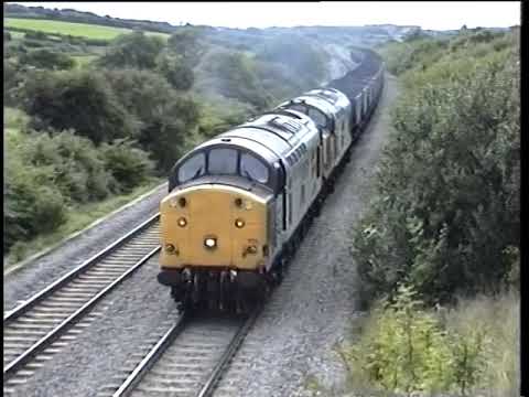 Diesels working hard on the grade.  A soundtrack of full power . 1990s style !!