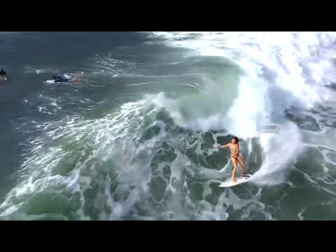 Expert Female Surfer Rides Wave in Bali - 1019720