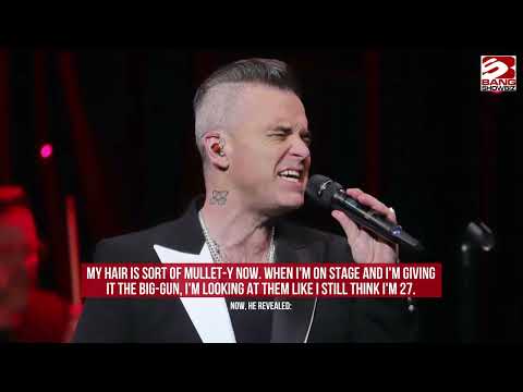 Robbie Williams says he may get a wig for touring following failed hair transplant