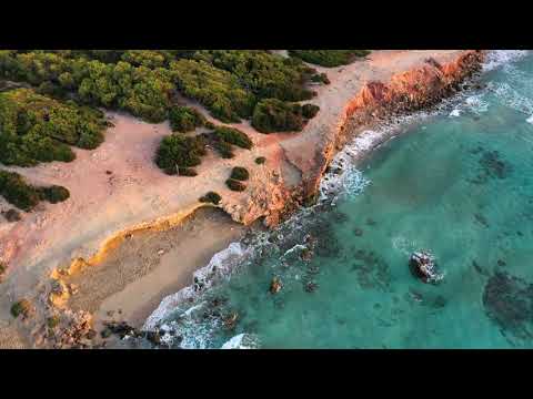 4K HDR relaxing waves over a sunset - ocean/sea waves crashing on a beach - ultra HD nature video