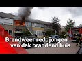 Brandweer redt jongen van dak bij uitslaande brand in Tilburg