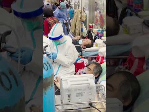 Hospitals in China pushed to brink as COVID surges