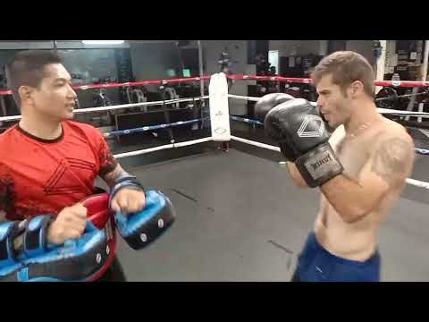 teenager videos and commentary Braeden doing pads with Rambo corporate box Lutwyche