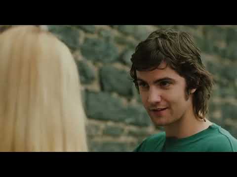 Across the Universe movie musical trailer still with Jude singing on a beach
