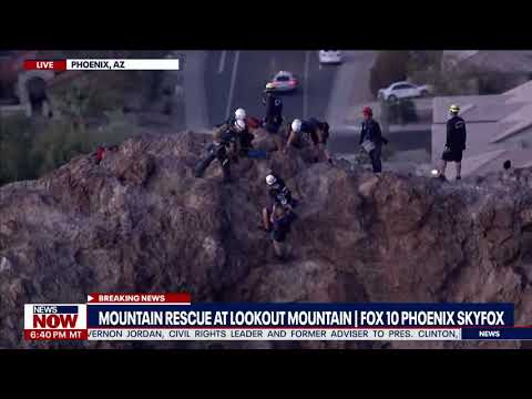 Watch this mountain rescue: Firefighter puts man on back, pulled to safety