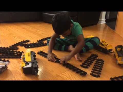 Trains for kids: unboxing train set – Caterpillar (CAT) motorized construction express train