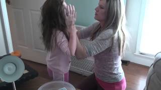 Severe Autism Meltdown. Mother Attempts to Restrain Autistic Daughter from Self-Injury