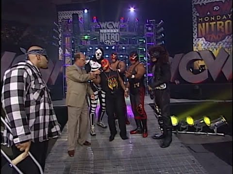 Konnan bullies an Injured Rey Mysterio during Promo. WCW Luchadores Stand Up for Rey! 1997