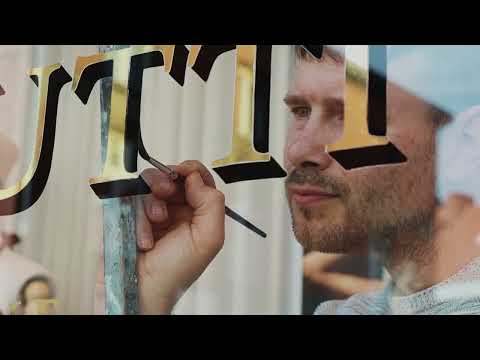 The process of Reverse Glass Gilding a lingerie store.