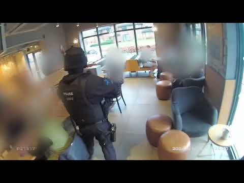 "Show me your hands" - armed officers arrest man in Starbucks