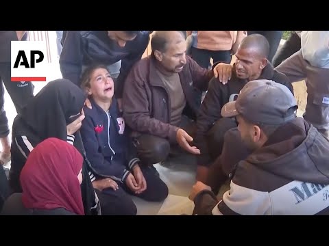 Palestinians mourn after at least 8 killed in Israel strikes in Gaza Strip