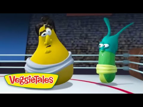 Two VeggieTales characters—yellow banana in a white robe and a green worm—stand in a boxing ring, VeggieTales logo visible in the corner.