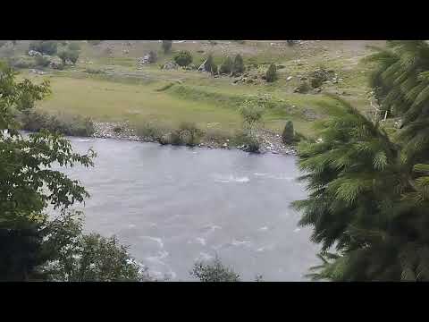 Deepna in the foothill of "Habba Khatoon Peak" Gurez, with her father.