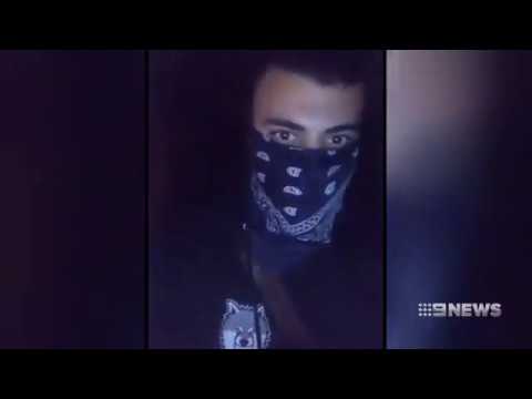 Disturbing vision of men laughing as fire burns around them