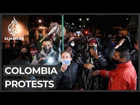 Colombians revel, protest over order to detain ex-President Uribe