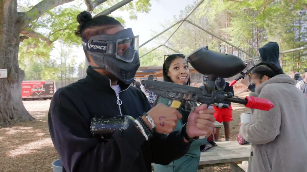 Devale shows the boys how to  Paint Ball