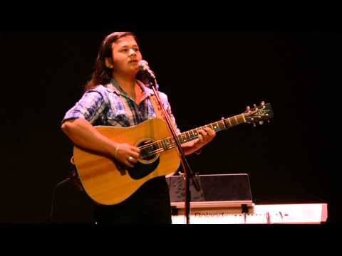 Matthew Songmaker playing guitar and singing "Make You Feel My Love".