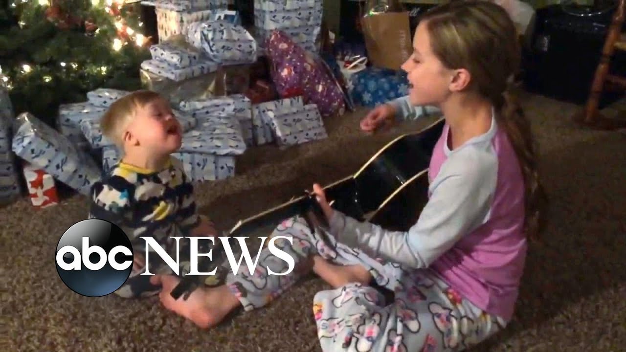 Toddler with Down syndrome sings with sister in video thanks to music therapy - YouTube