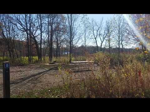 A span showing how close sites are positioned and a view of how site #8 has a great view looking down and across to the lake and how it is a bit more separated from neighbors