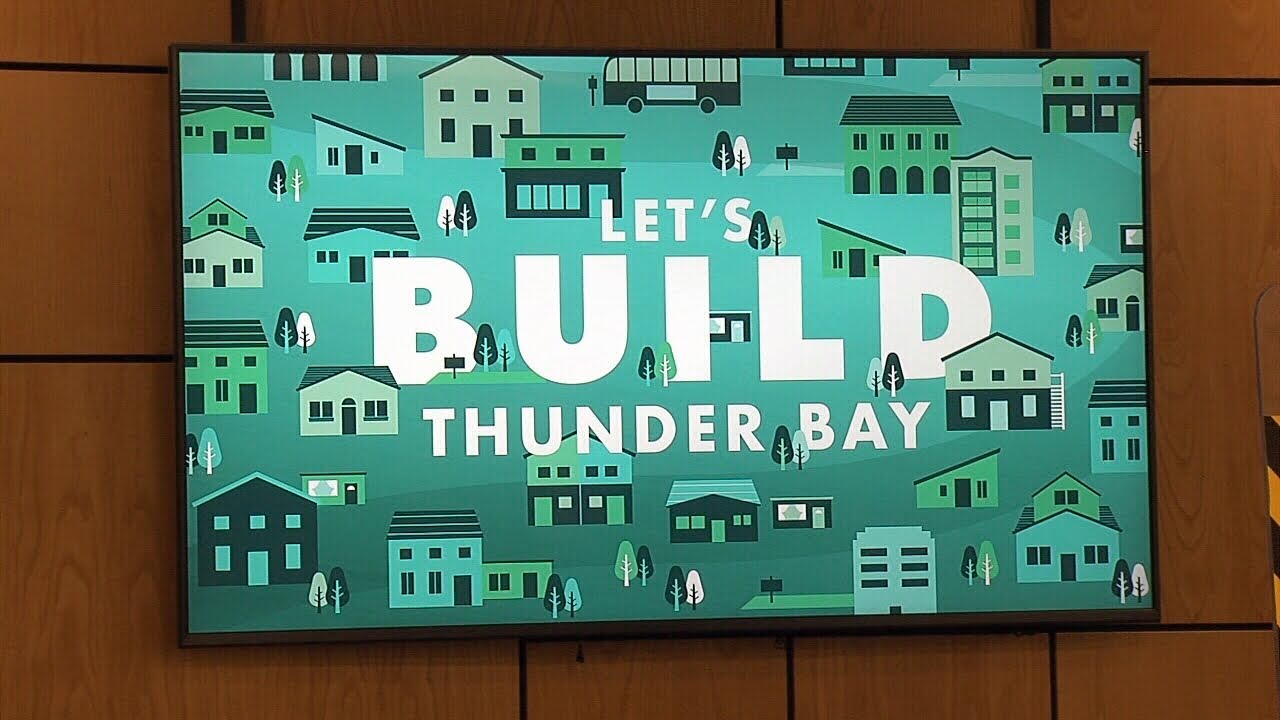 Banner unveiled at City Hall to showcase housing commitment