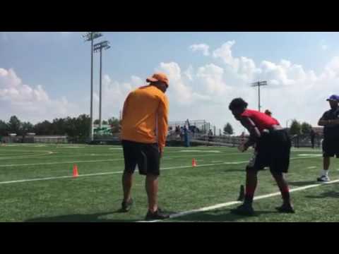 Tennessee assistant Robert Gillespie puts backs through a drill at Buford High School in Georgia on
