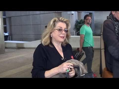 Catherine Deneuve Corrects At LAX: 'I'm Not Married'