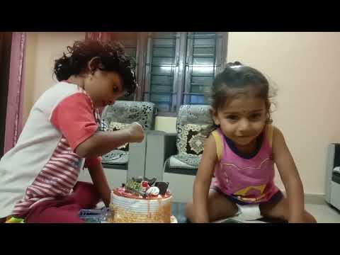 my daughters cutting cake on new year day