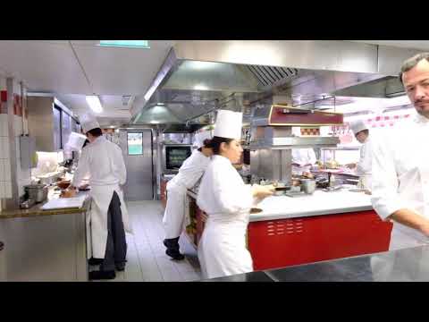 Busy Kitchen at 3 Michelin star Alain Ducasse au Plaza Athénée in Paris, France