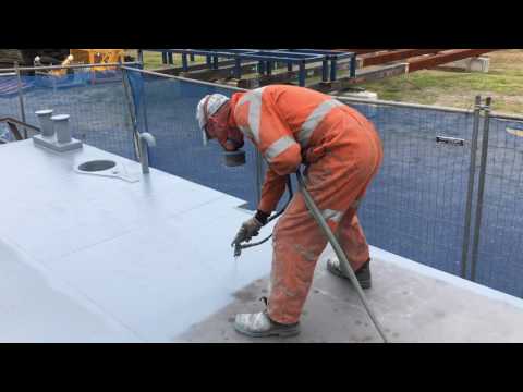 Painting steel barge