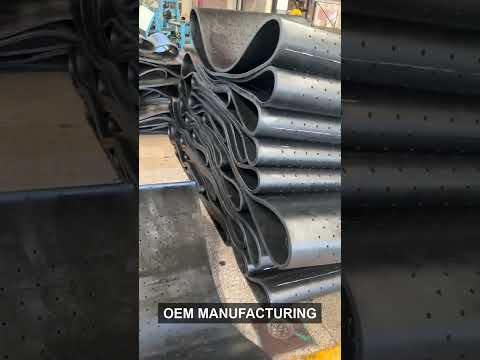 Shot blasting machine rubber track operating in a tumble blast machine