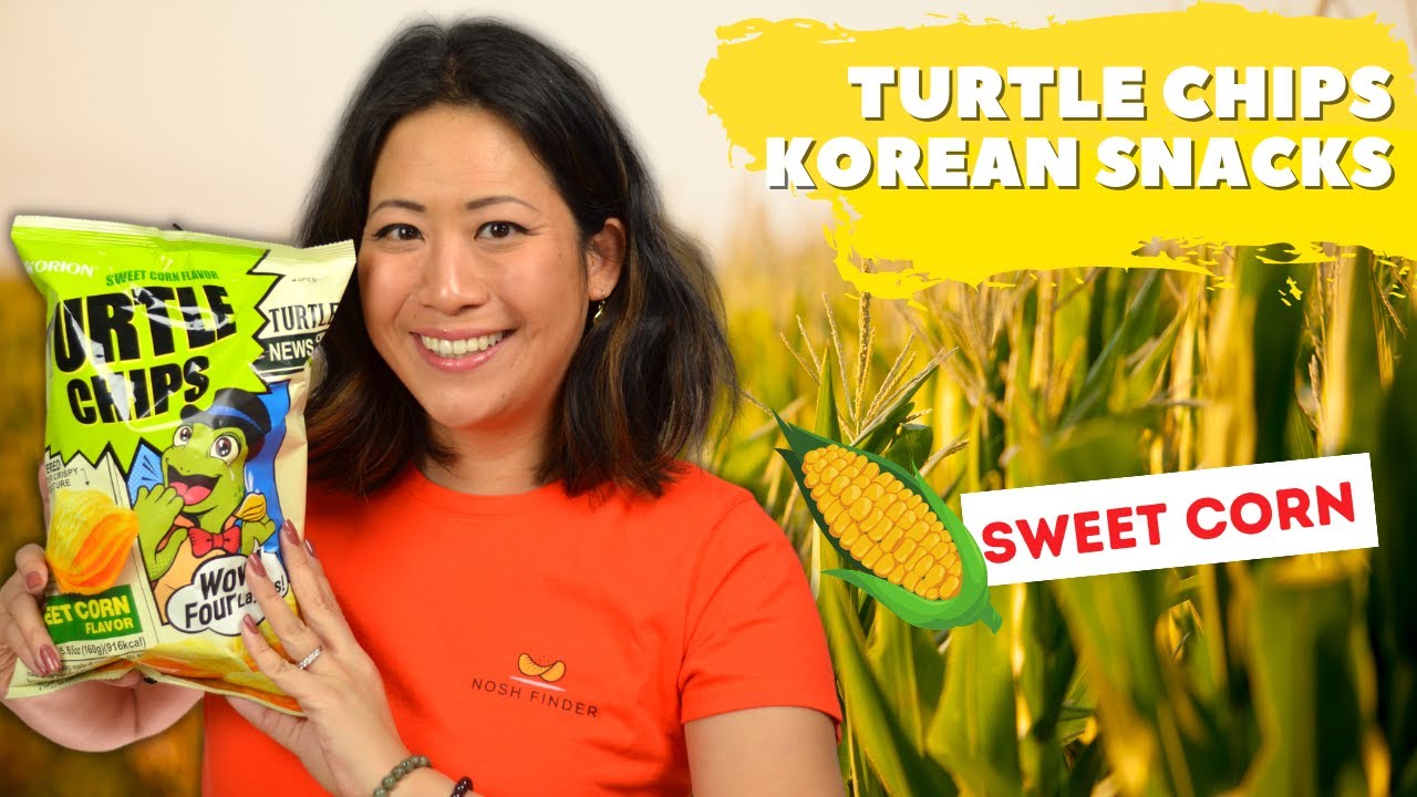 An open bag of Orion Turtle Chips Sweet Corn Flavor with chips on a white plate showing the golden yellow corn seasoning coating