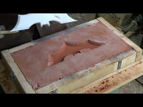 The Brass Batman Logo