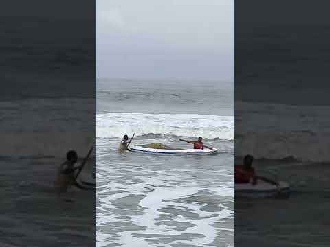 Fishermen struggle to reach the shore