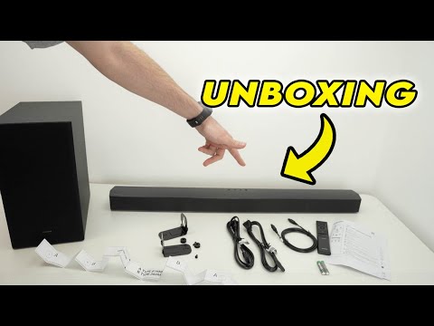 thumbnail of video showing image of Samsung Soundbar and Subwoofer combo set with arm with watch on it pointing to soundbar and word unboxing near top left showing arrow pointing down with a curve toward the soundbar.