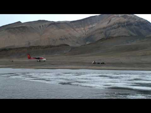 Twin Otter landing in the arctic island 