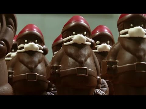 Chocolate Santas wear marzipan face masks