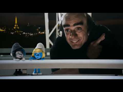The Smurfs 2 trailer frame: Smurfette in Paris at night, neon reflections and a pop track pulsing
