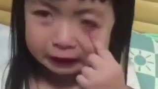 Cute little girl trying to cry but mom keeps wiping her tears.