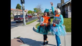 Day of Hope: Volunteers take to the street selling newspapers for donations toward cancer patients