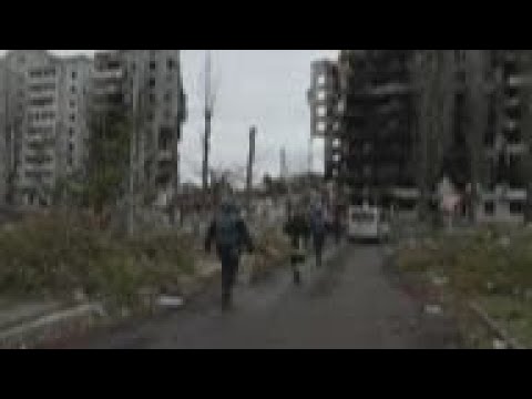 Ukrainian forces clear area after Russians retreat