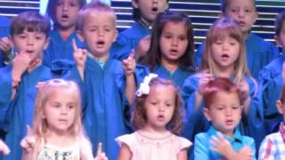 Cate singing "Praise Him, Praise Him all ye little children"